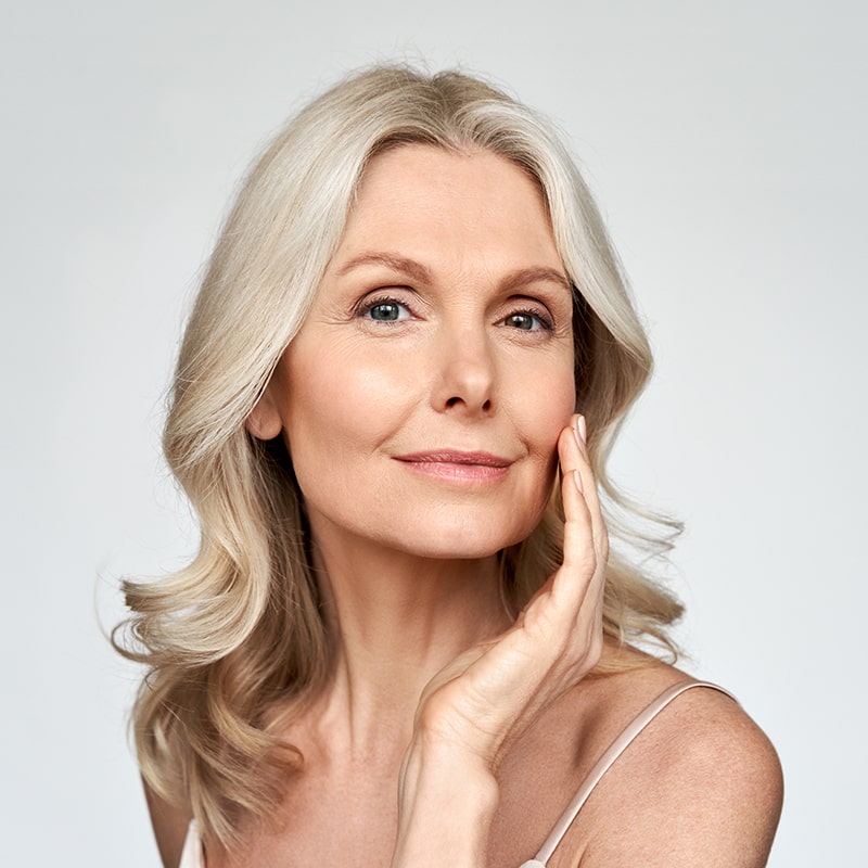 Image of a middle aged woman with beautiful skin after a cryotherapy facial