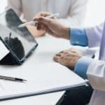Dr. Scott™ discussing personalized metabolic wellness options with a patient